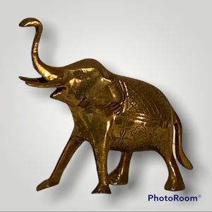 Brass tone elephant.